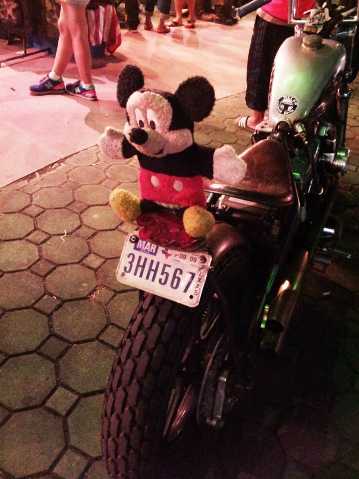 mickey mouse toy on a bike