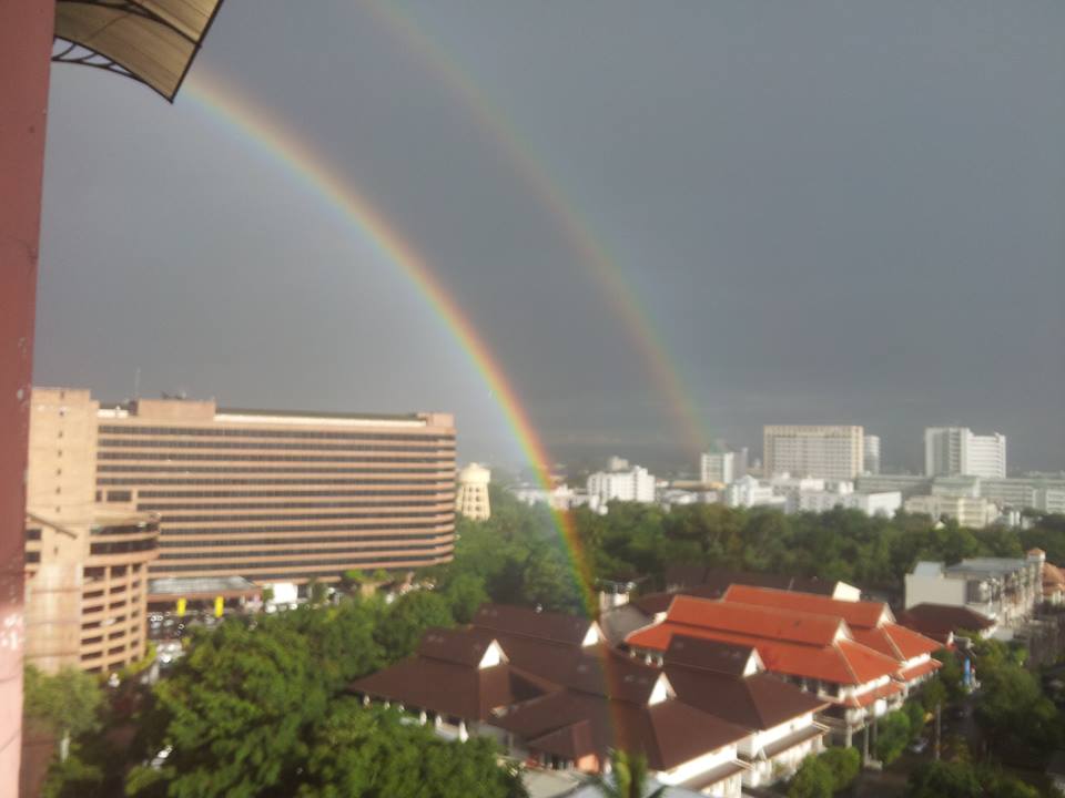 a double rainbow over a city