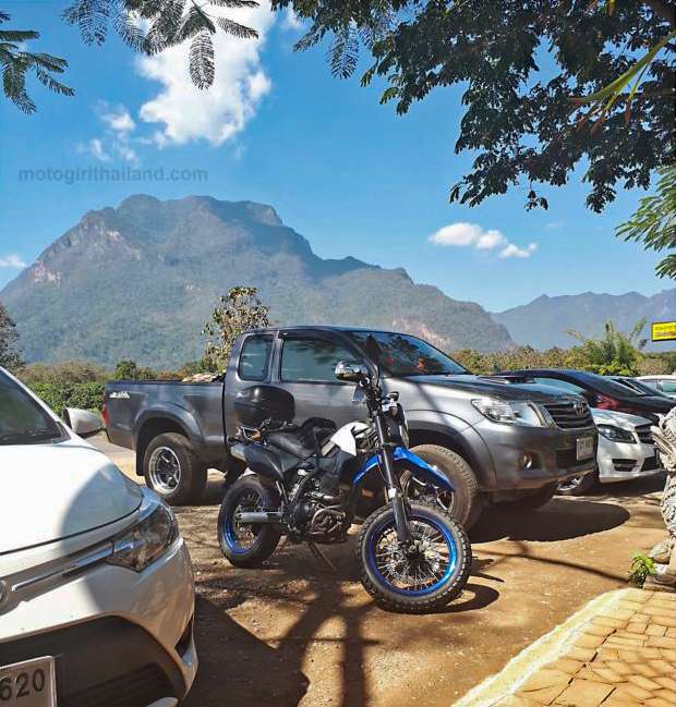 a motorcycle and Chiang Dao Mountain