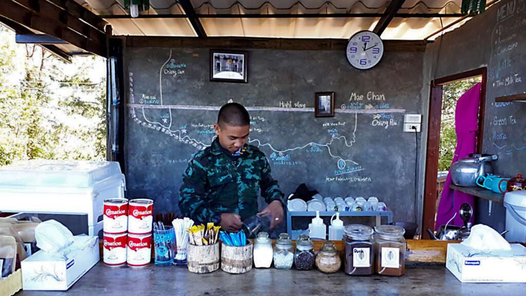 Thai army solider making coffee