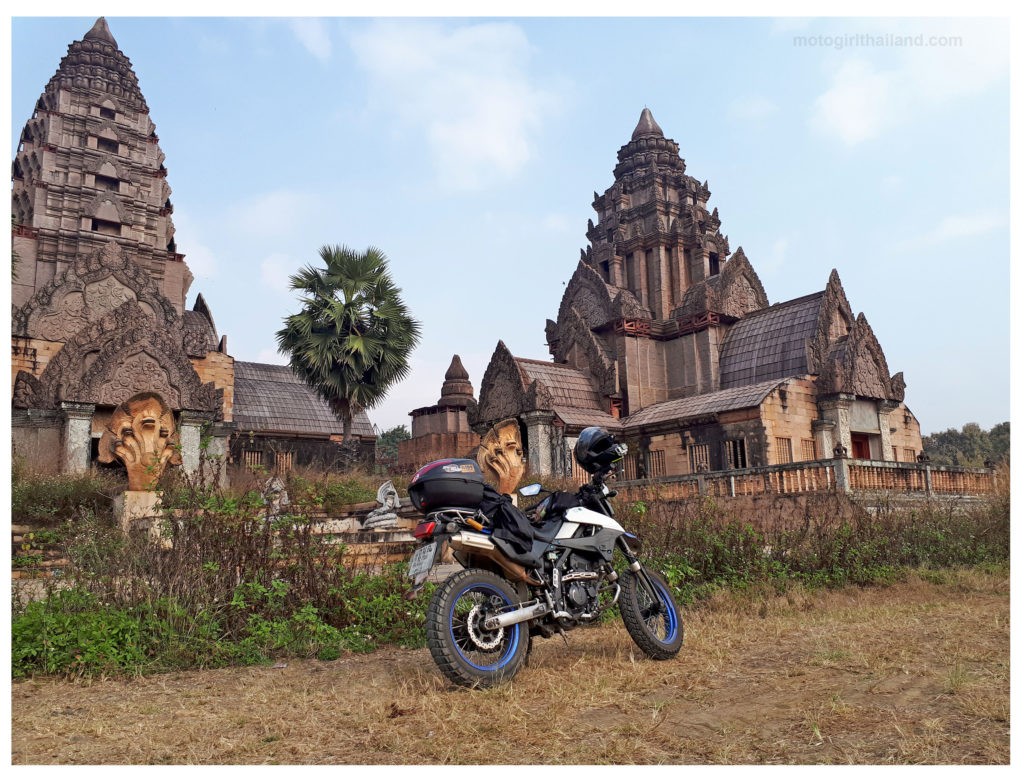 a motorbike outside a Khmer style Angkor Wat building