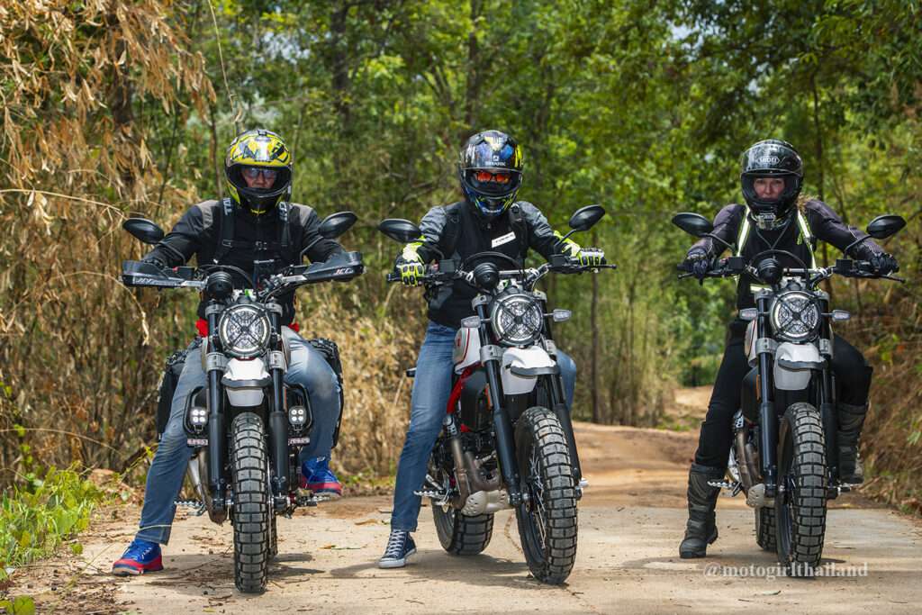 three people riding Ducati Desert Sleds. Chiang Mai