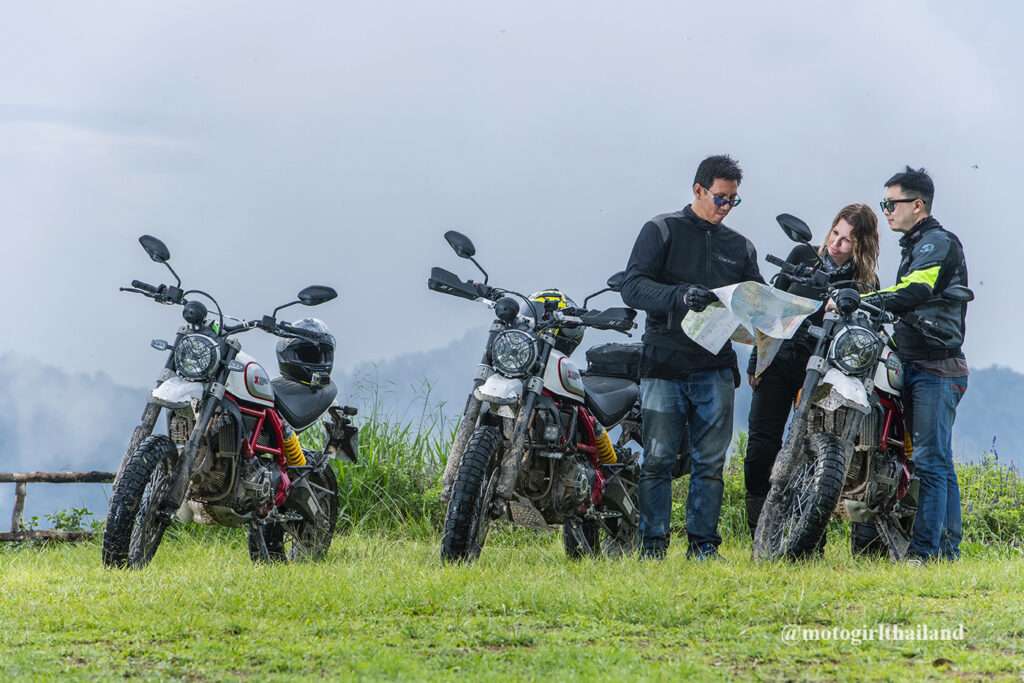 Group of people at a viewpoint with Ducati Motorcycles . Dart tours. Chiang Mai. Motogirlthailand. 