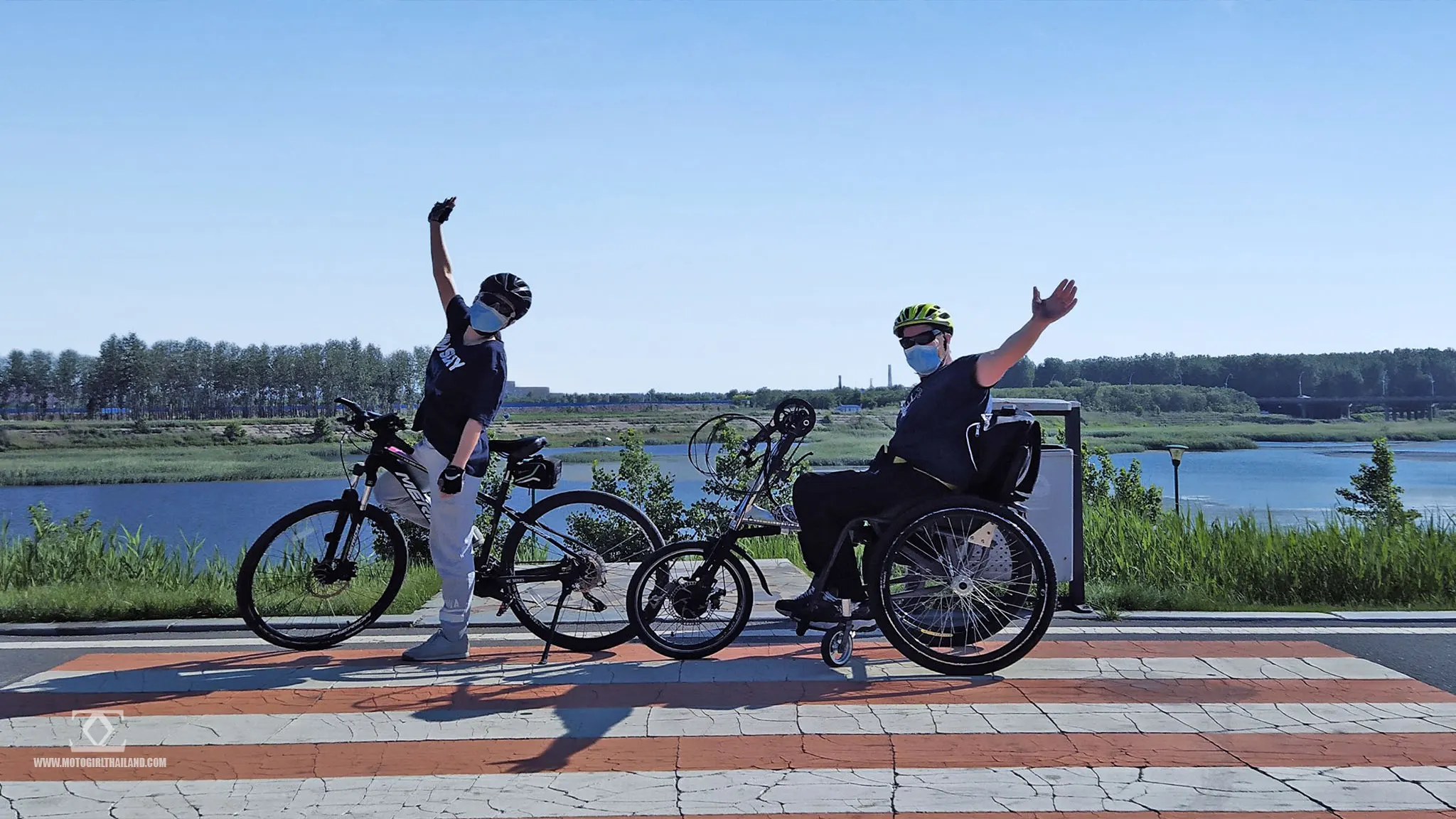 couple on bike and wheelchair bike