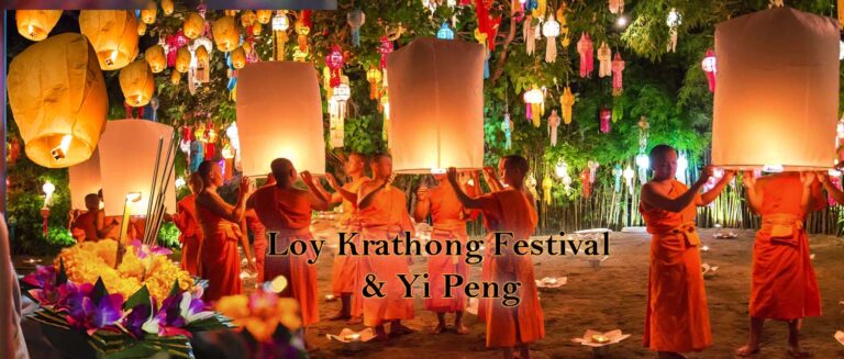 A group of monks in orange robs holding large lanterns ready to go into the sky. Loy Krathong and Yi Peng Festival in Chiang mai, Thailand - motogirlthailand