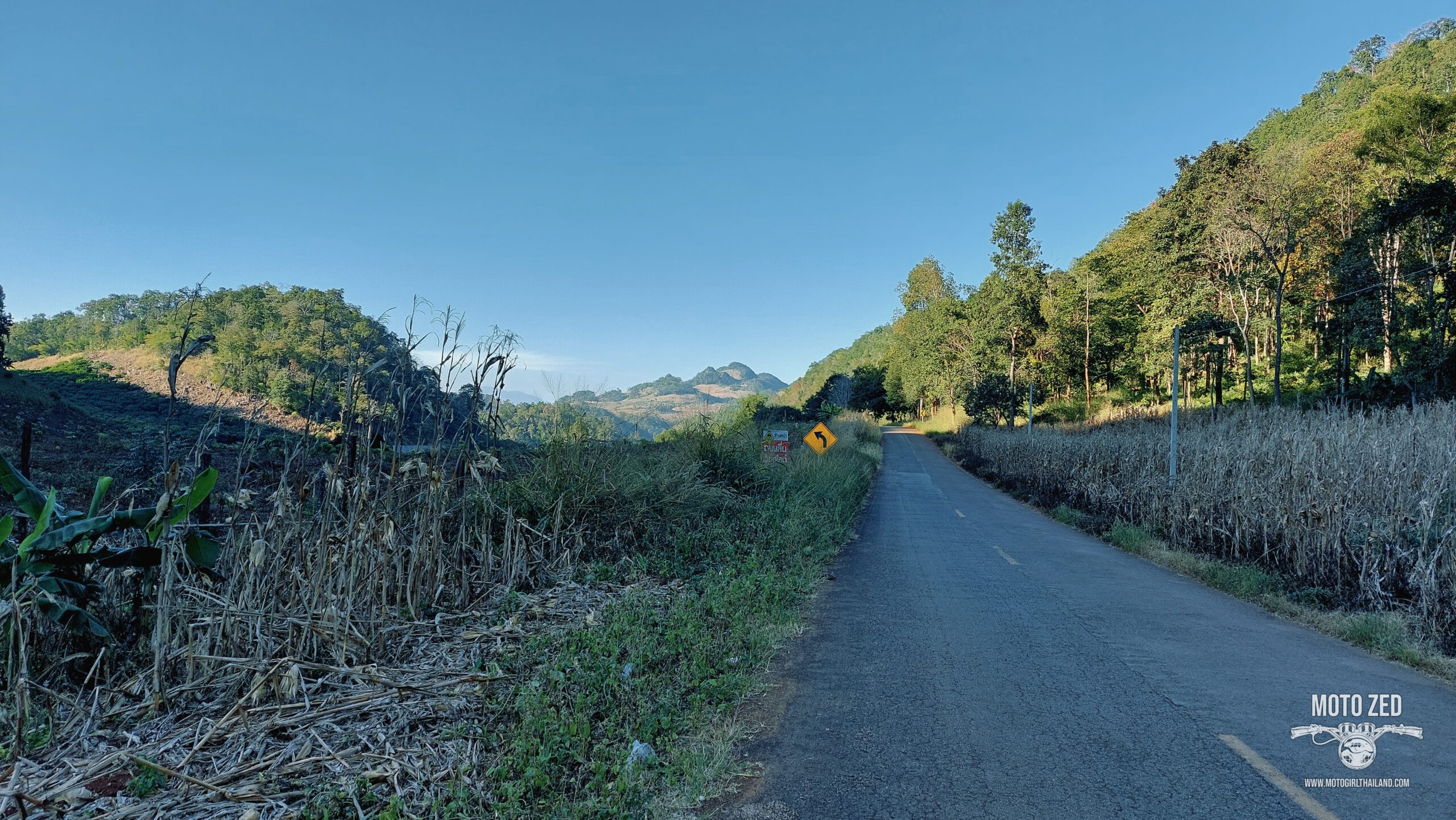 back road in thailand with mountain view