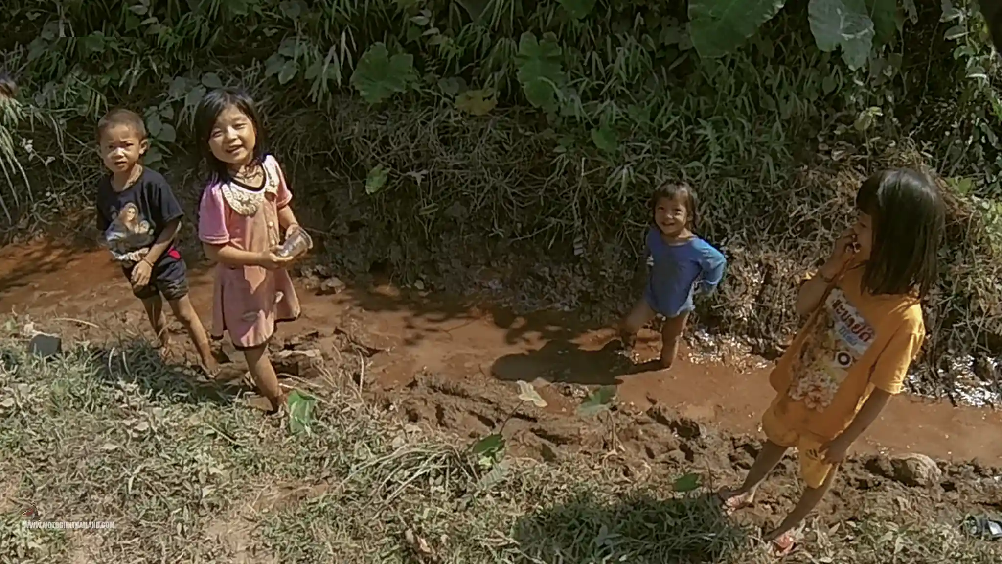 Laos Children Playing in Mud