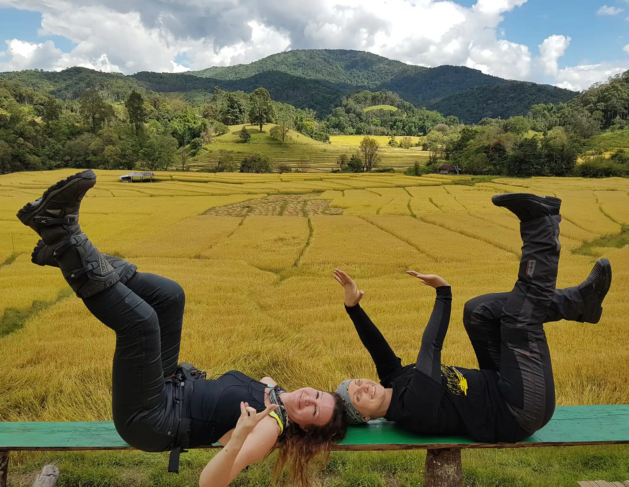 two ladies with a yellow field